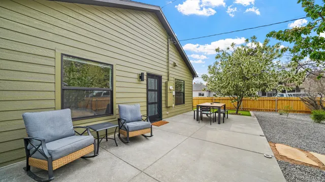a view of a two chairs in the patio