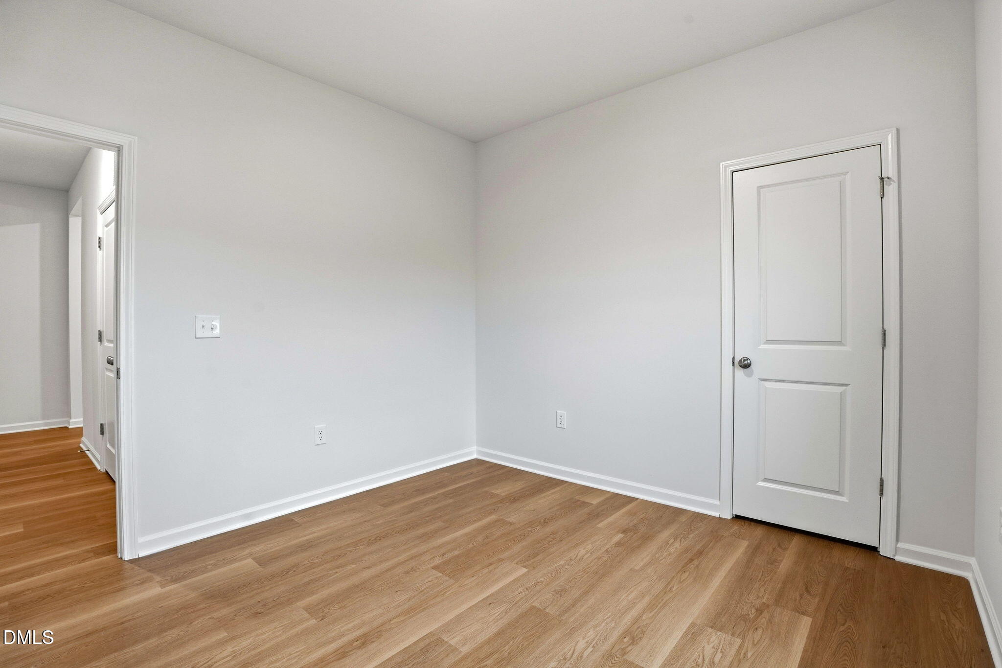 9019 Phoenix Court Spring Hope, NC 27882 - Photo 11 of 34 a view of an empty room with wooden floor and closet