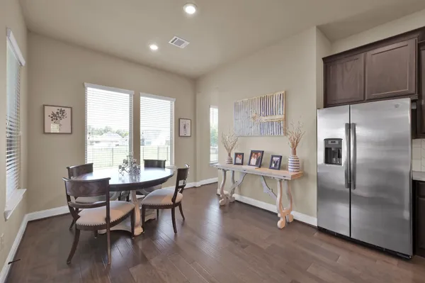 a spacious bathroom with a granite countertop sink mirror and shower