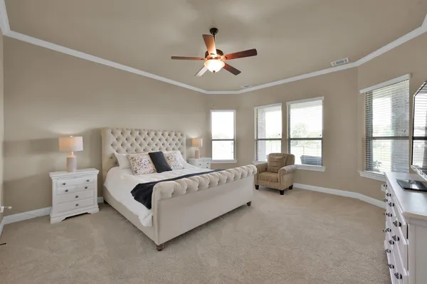 a en suite bathroom with a sink a mirror and a vanity