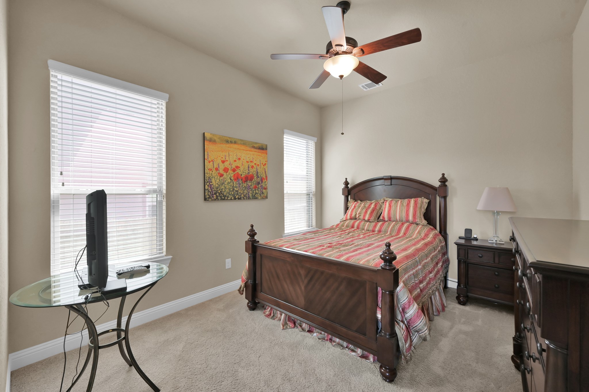 4906 Tres Lagos Drive Spring, TX 77389 - Photo 17 of 32 a bedroom with a bed a desk and chair