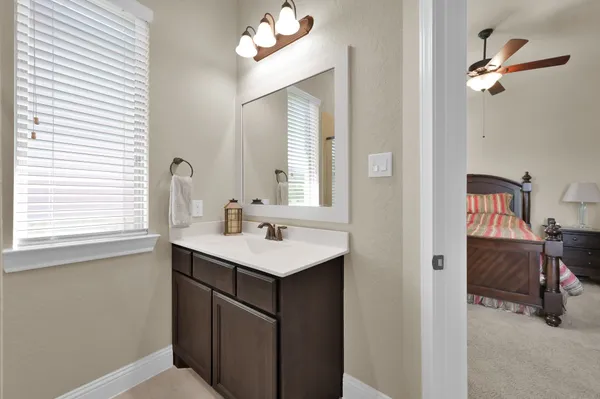 a bed room with a bed and a window