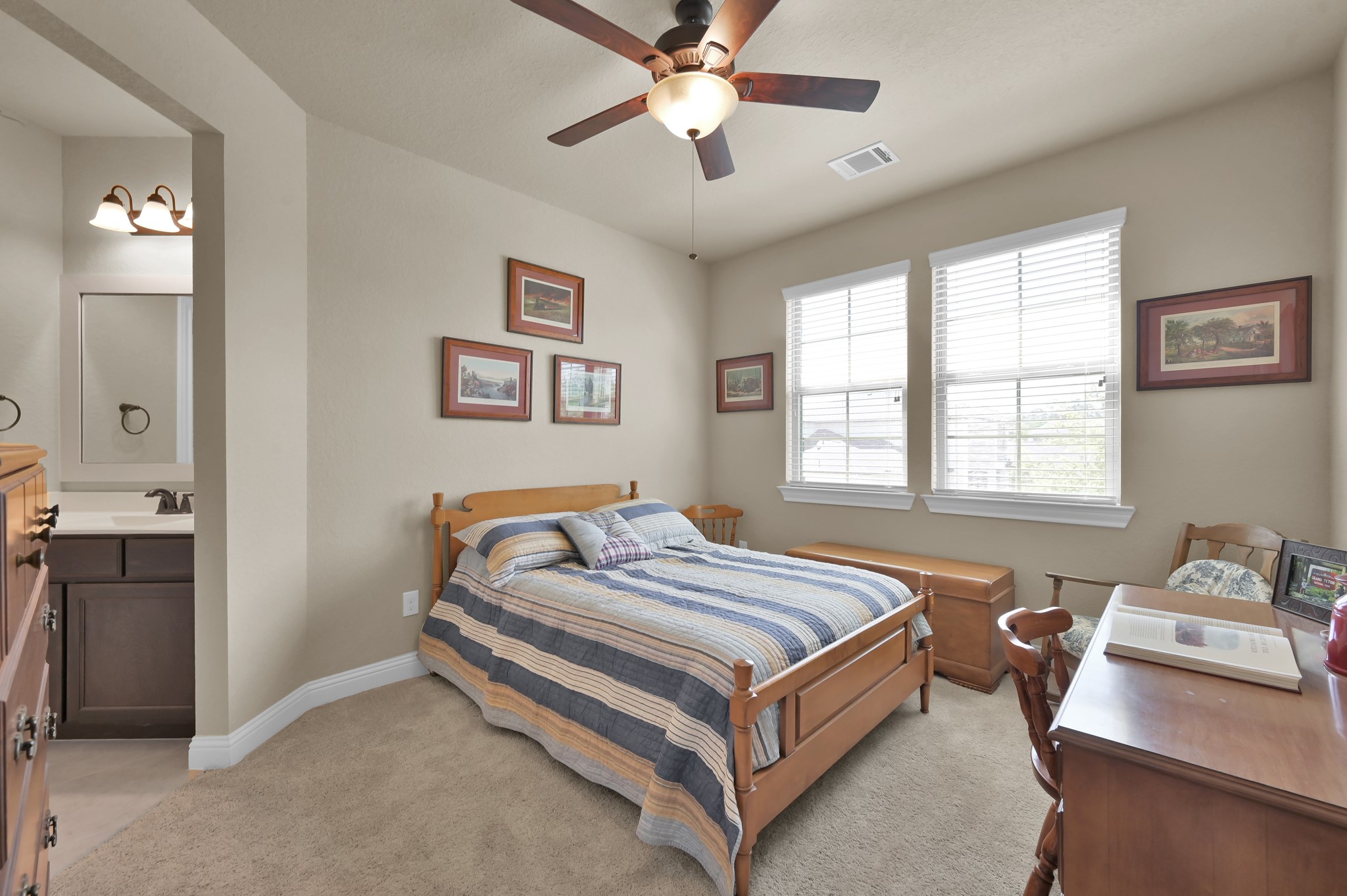 4906 Tres Lagos Drive Spring, TX 77389 - Photo 19 of 32 a spacious bedroom with a bed and window
