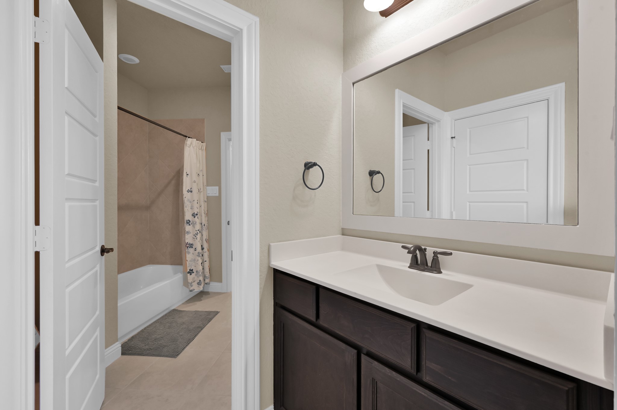 4906 Tres Lagos Drive Spring, TX 77389 - Photo 20 of 32 a bathroom with a sink toilet a shower and a mirror