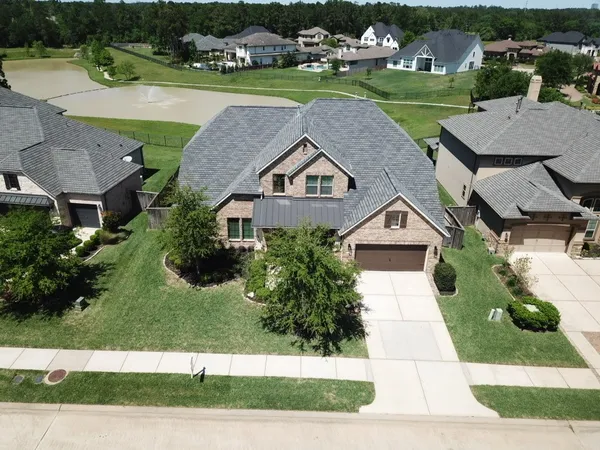an aerial view of a house with a garden