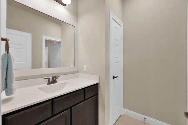 a view of a garden with lawn chairs and a yard