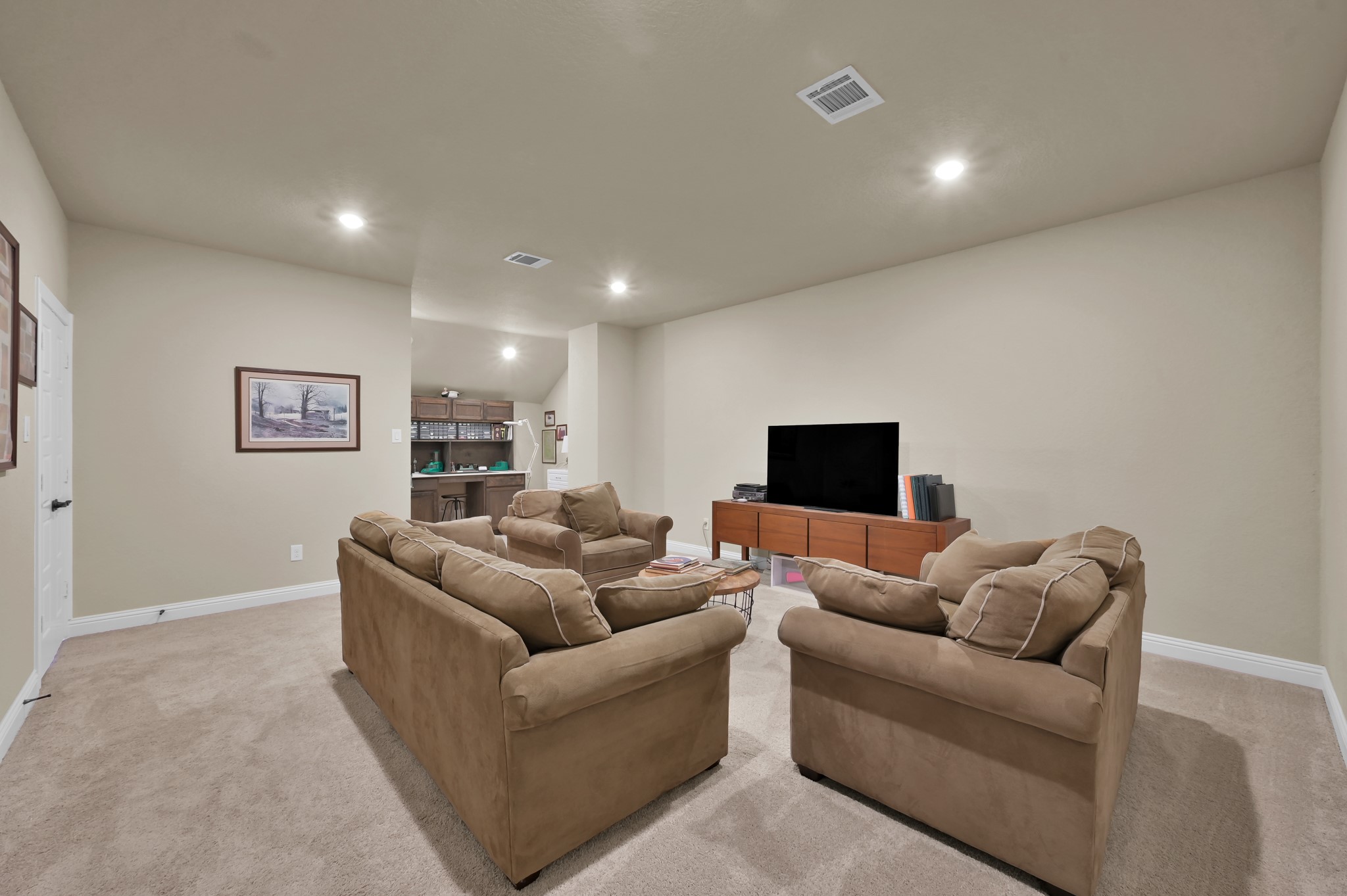 4906 Tres Lagos Drive Spring, TX 77389 - Photo 23 of 32 a living room with furniture and a flat screen tv
