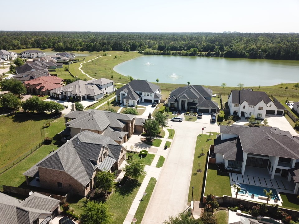 4906 Tres Lagos Drive Spring, TX 77389 - Photo 28 of 32 an aerial view of a house with lake view