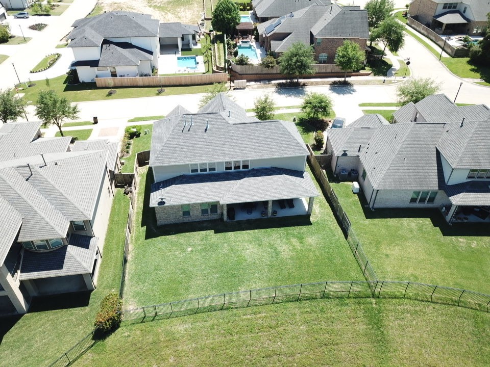 4906 Tres Lagos Drive Spring, TX 77389 - Photo 31 of 32 a view of a swimming pool with a patio