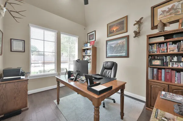 a living room with furniture a window and a bookshelf