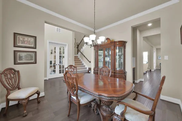a dining room with furniture and window