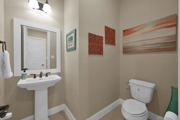 a living room with furniture kitchen view and a fireplace