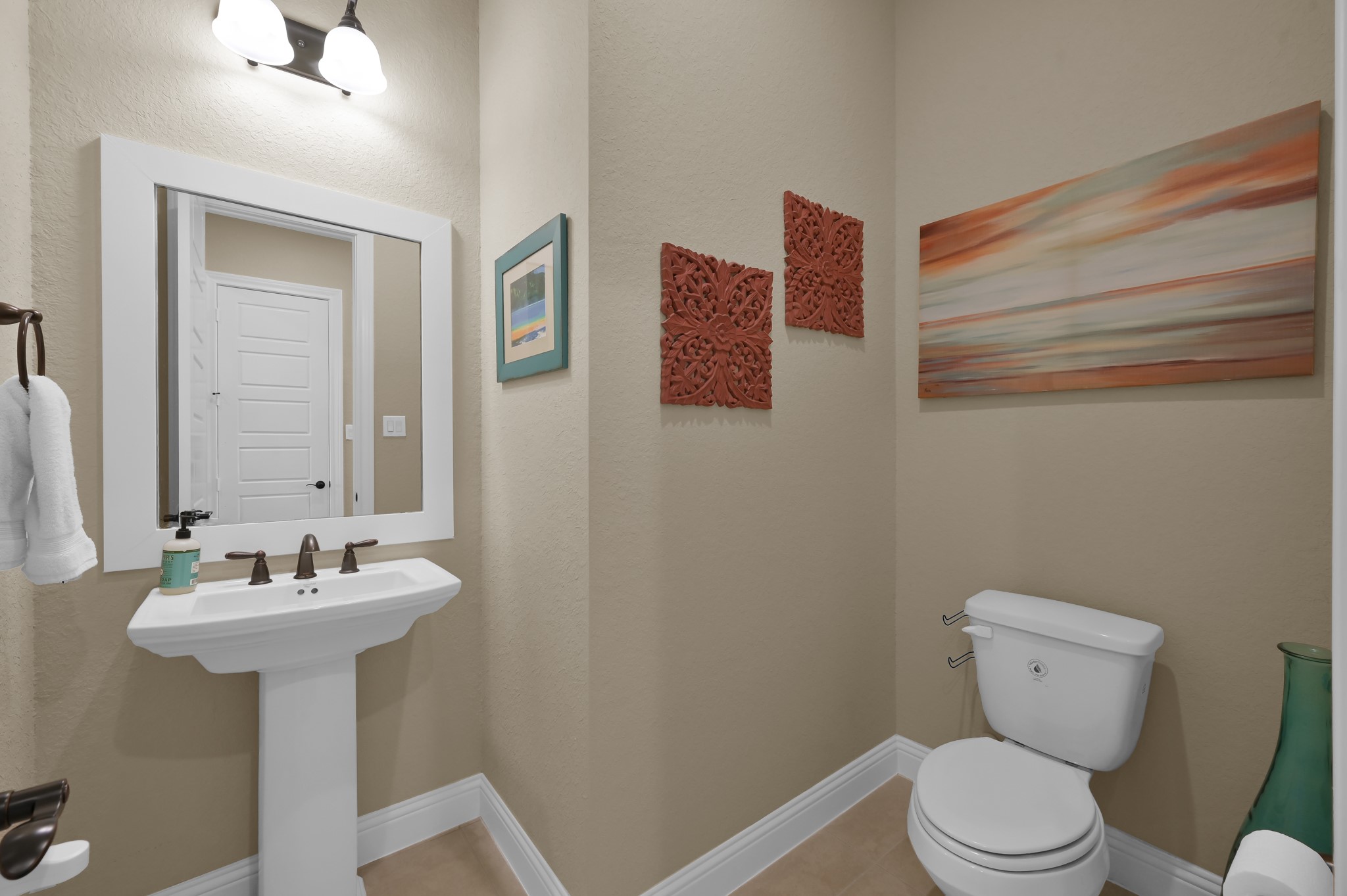 4906 Tres Lagos Drive Spring, TX 77389 - Photo 7 of 32 a bathroom with a toilet sink and mirror