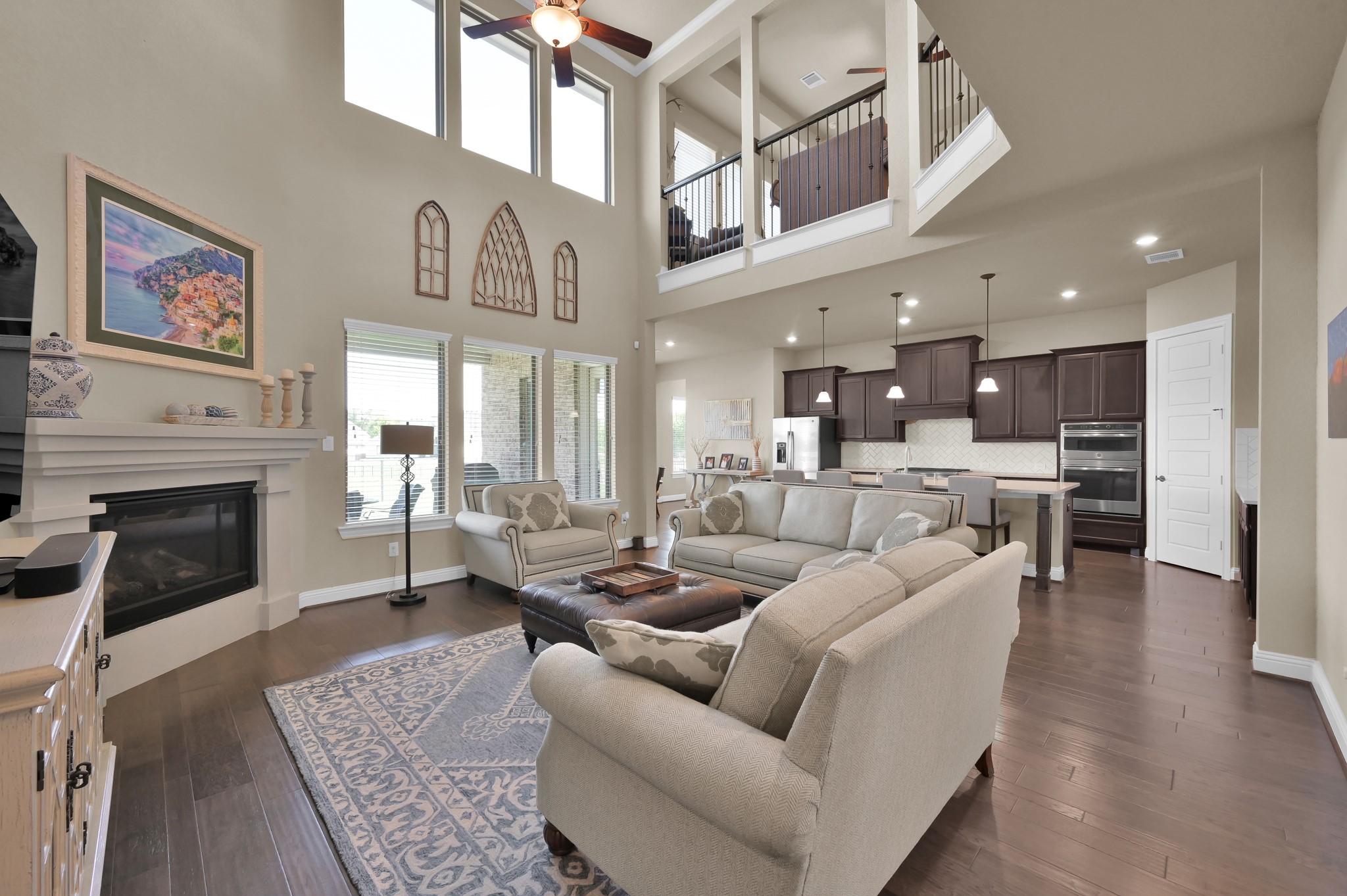 4906 Tres Lagos Drive Spring, TX 77389 - Photo 8 of 32 a living room with furniture kitchen view and a fireplace