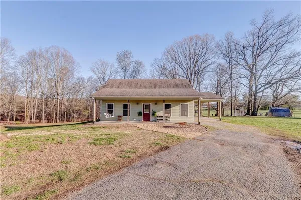 a house with trees in the background