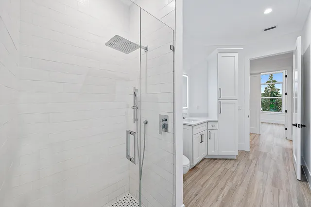 a bathroom with a bathtub and shower