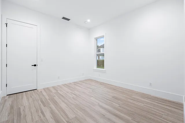 a living room with patio furniture and a yard