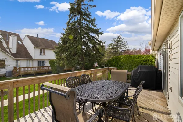 a view of balcony with furniture and city view