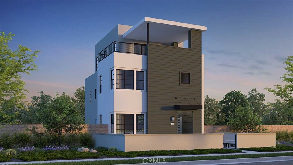 a front view of a house with plants