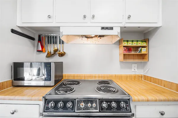 a kitchen with a stove and a sink
