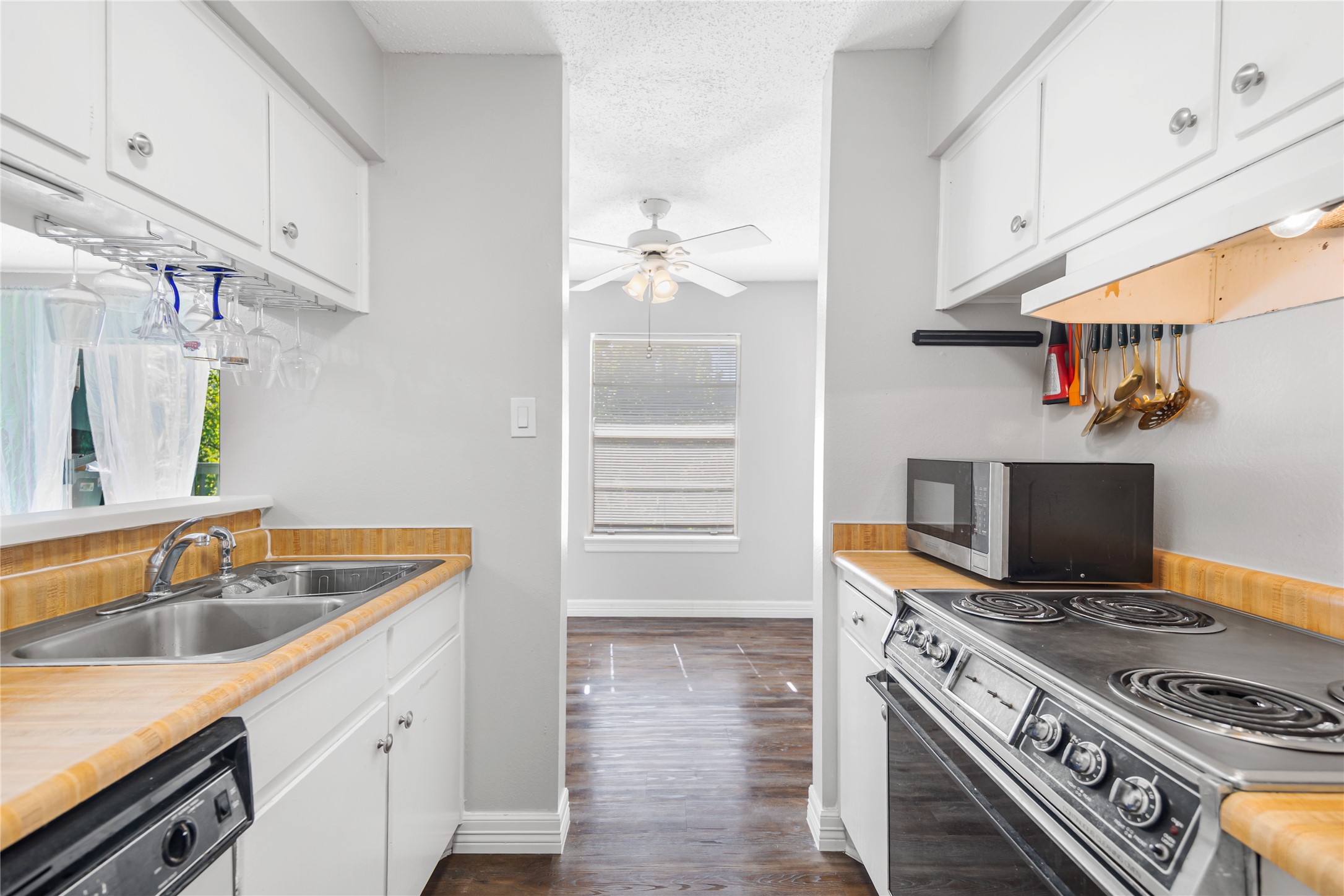 8233 Kingsbrook Road, Unit 233 Houston, TX 77024 - Photo 14 of 24 a kitchen with a stove and a sink