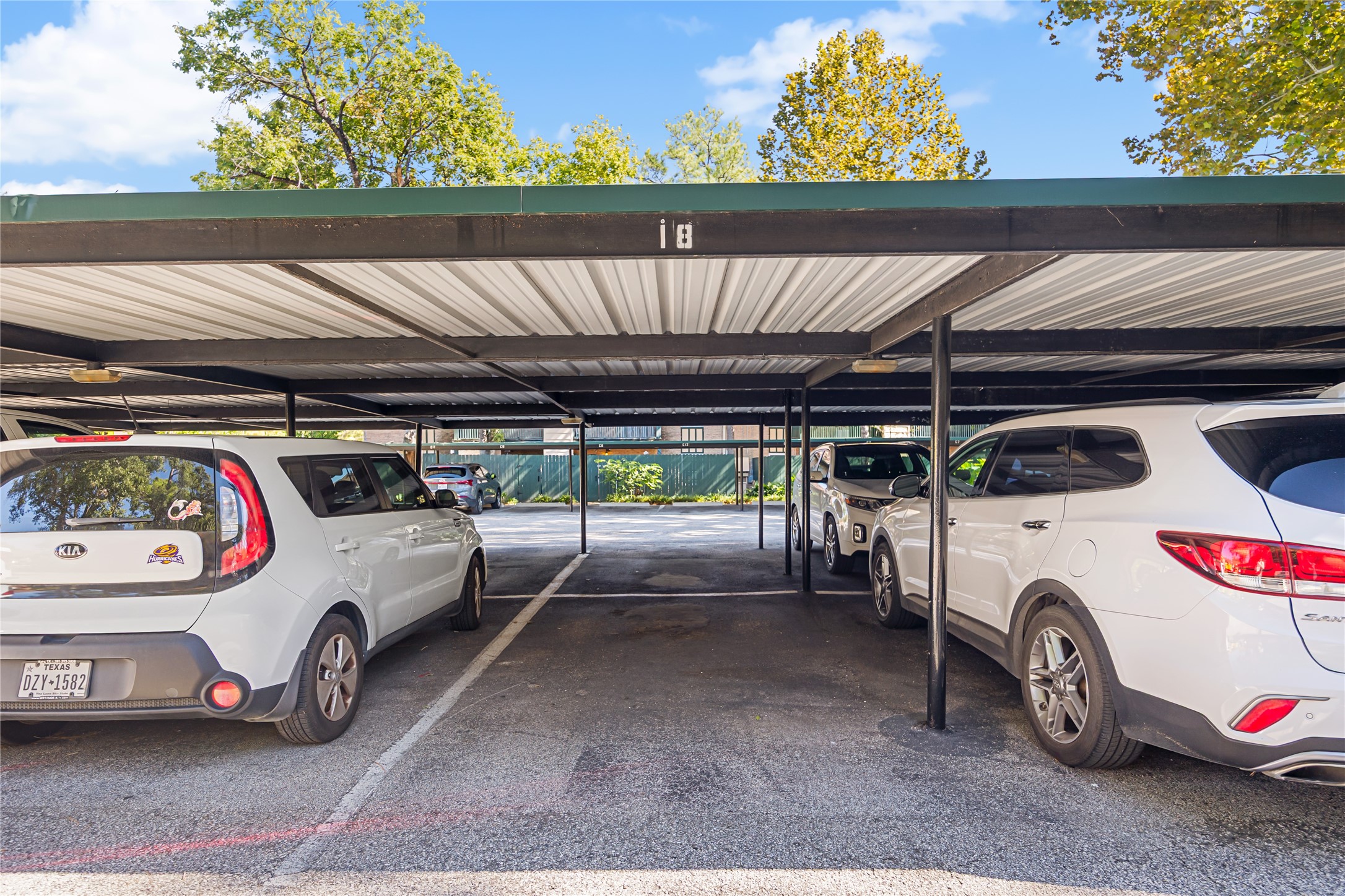 8233 Kingsbrook Road, Unit 233 Houston, TX 77024 - Photo 23 of 24 a view of car parking