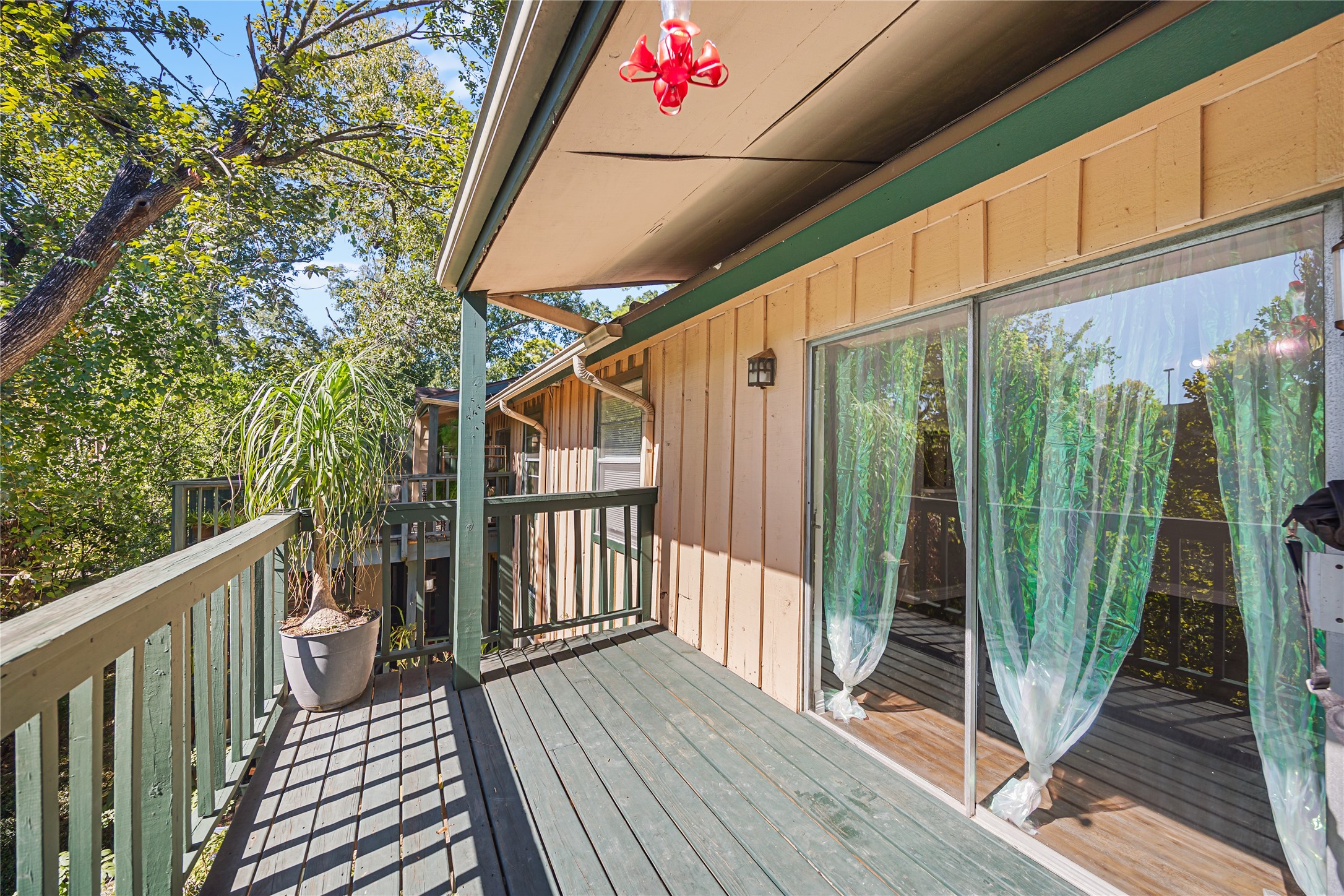 8233 Kingsbrook Road, Unit 233 Houston, TX 77024 - Photo 3 of 24 a view of balcony with wooden floor and iron stairs