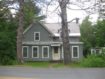 1185 Middle Road Clarksburg, MA 01247 - Photo 1 of 11 a front view of a house with a garden and trees