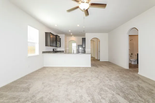 a view of a kitchen with a sink and a microwave