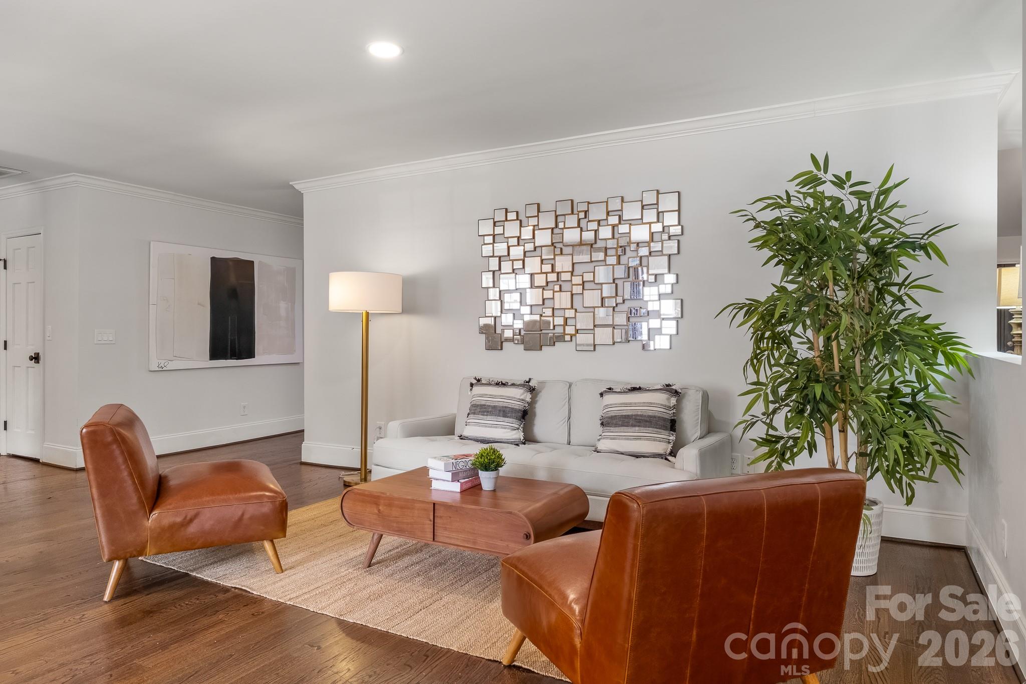 1121 South Wendover Road Charlotte, NC 28211 - Photo 15 of 48 a living room with furniture a potted plant and a window