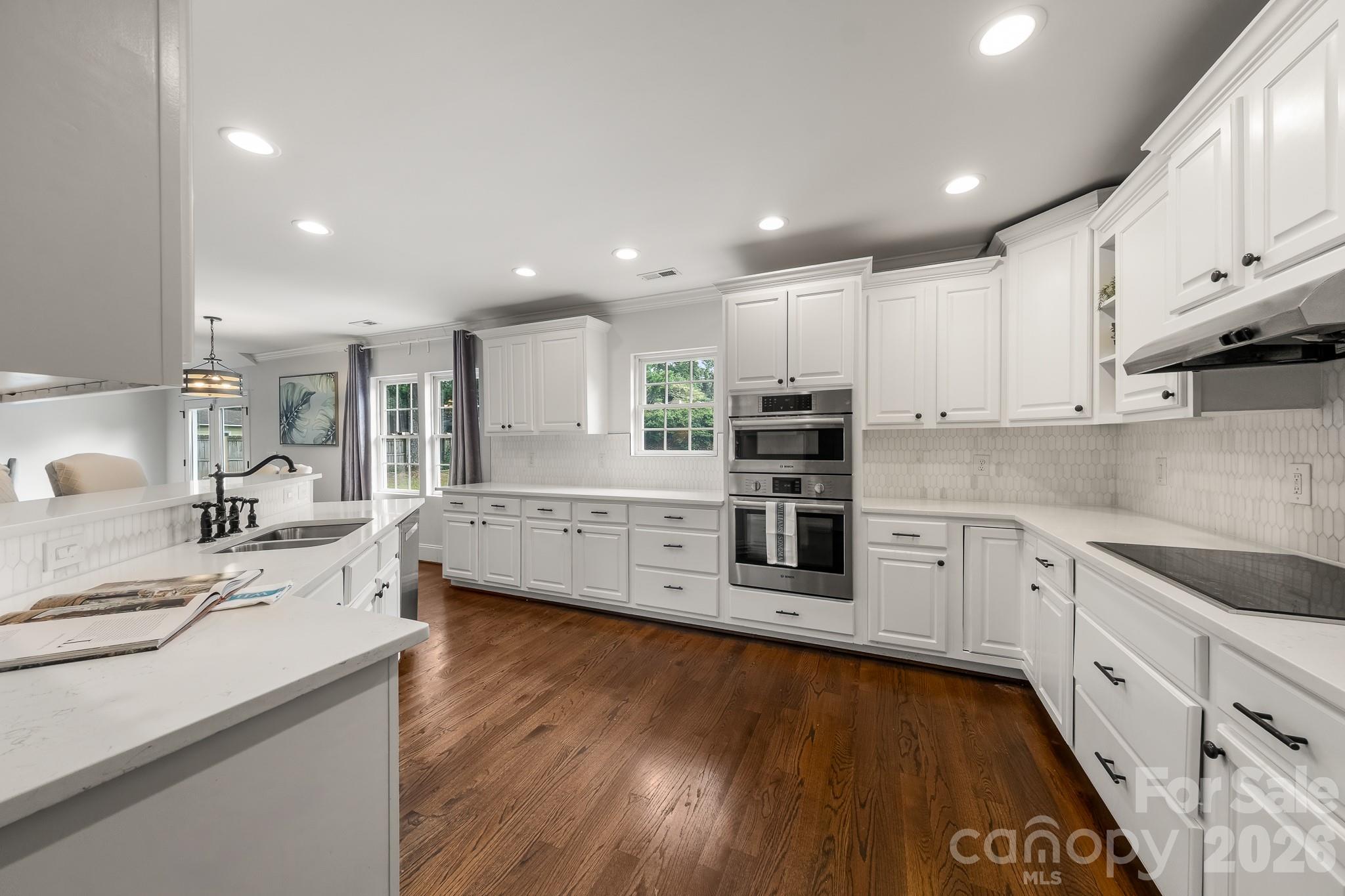 1121 South Wendover Road Charlotte, NC 28211 - Photo 16 of 48 a large kitchen with stainless steel appliances granite countertop a large center island and a sink
