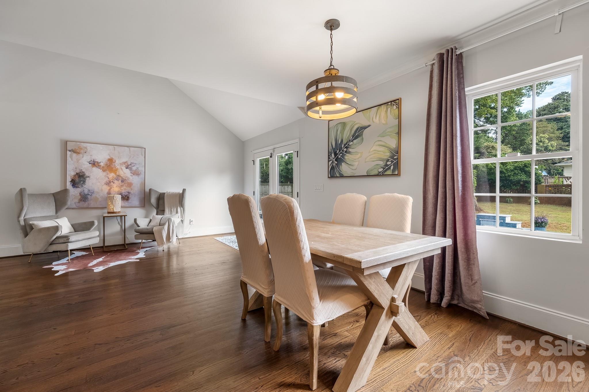 1121 South Wendover Road Charlotte, NC 28211 - Photo 20 of 48 a view of a dining room with furniture wooden floor and chandelier
