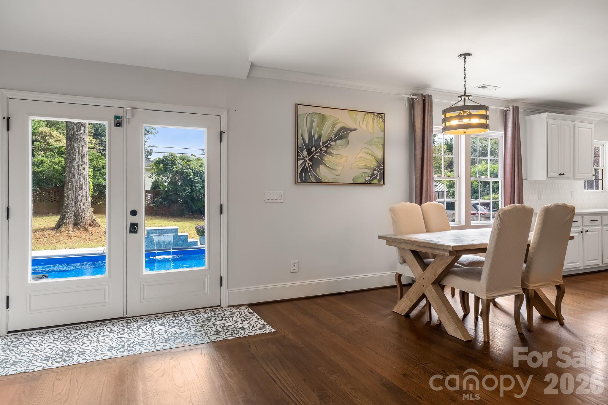 1121 South Wendover Road Charlotte, NC 28211 - Photo 22 of 48 a view of a dining room with furniture window and wooden floor