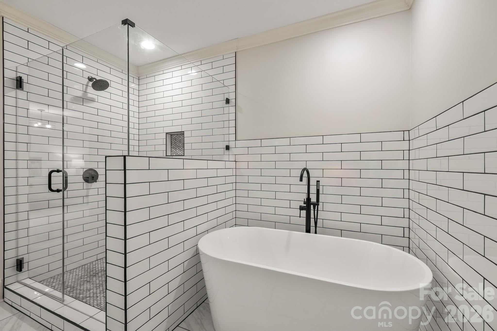 1121 South Wendover Road Charlotte, NC 28211 - Photo 27 of 48 a bathroom with a bathtub and shower