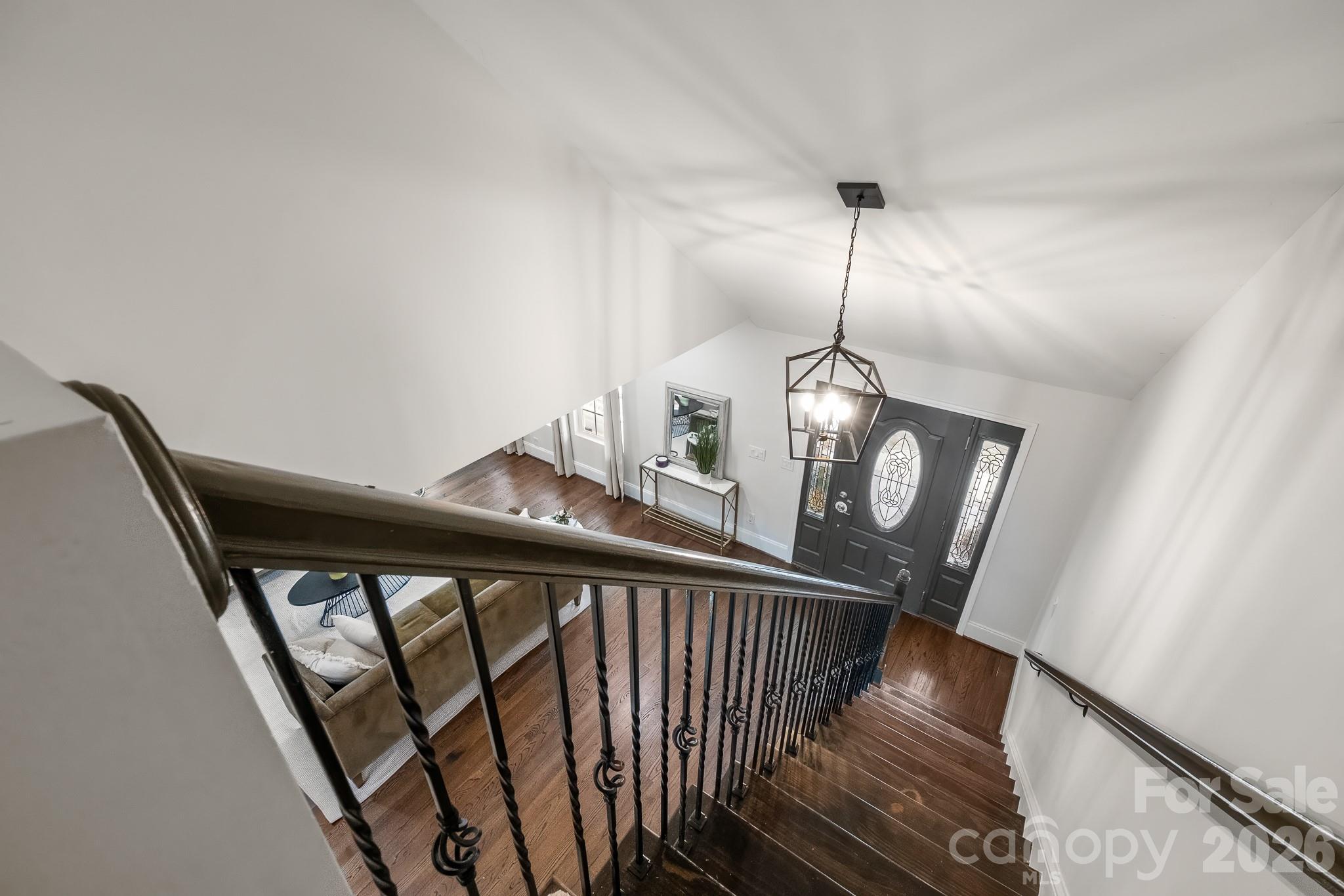 1121 South Wendover Road Charlotte, NC 28211 - Photo 29 of 48 a view of a hallway with wooden floor and stairs