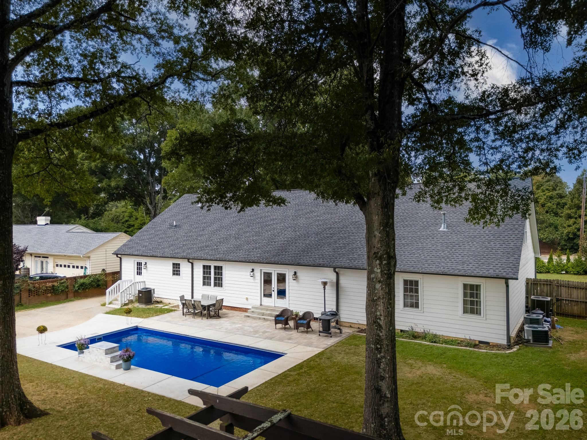 1121 South Wendover Road Charlotte, NC 28211 - Photo 3 of 48 a aerial view of a house with swimming pool and chairs