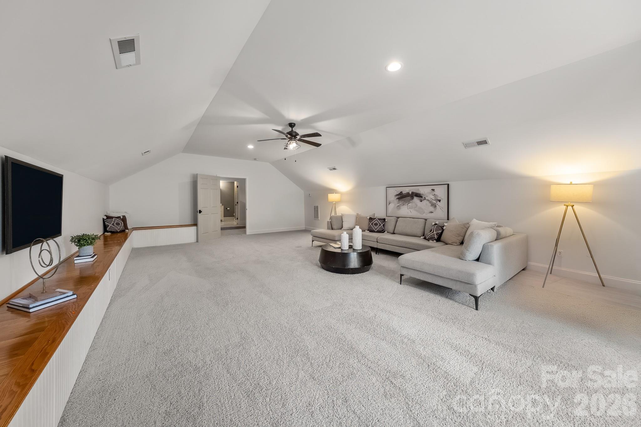 1121 South Wendover Road Charlotte, NC 28211 - Photo 31 of 48 a living room with furniture and a flat screen tv