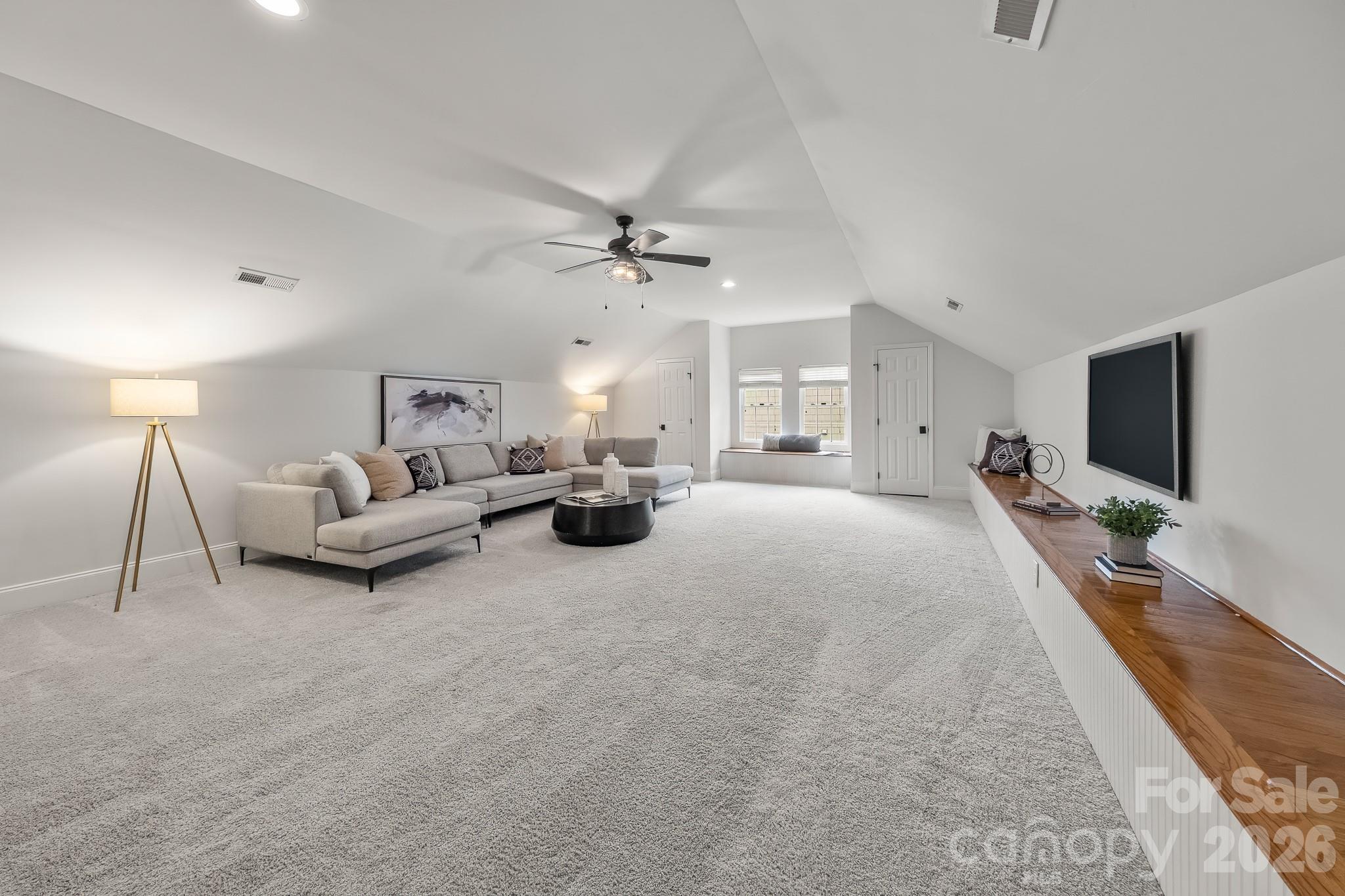 1121 South Wendover Road Charlotte, NC 28211 - Photo 32 of 48 a living room with furniture and a flat screen tv