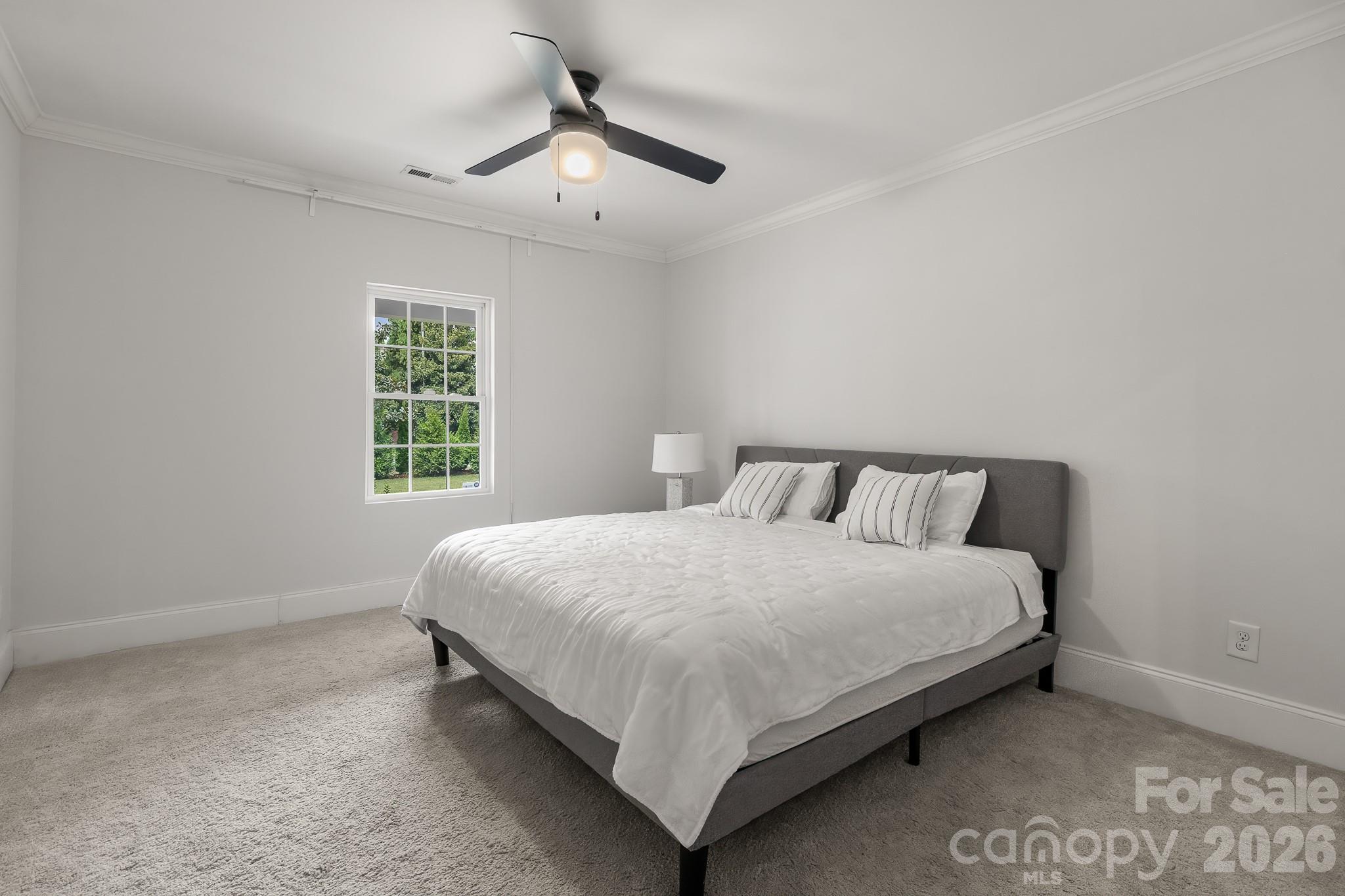 1121 South Wendover Road Charlotte, NC 28211 - Photo 39 of 48 a bedroom with a bed and window