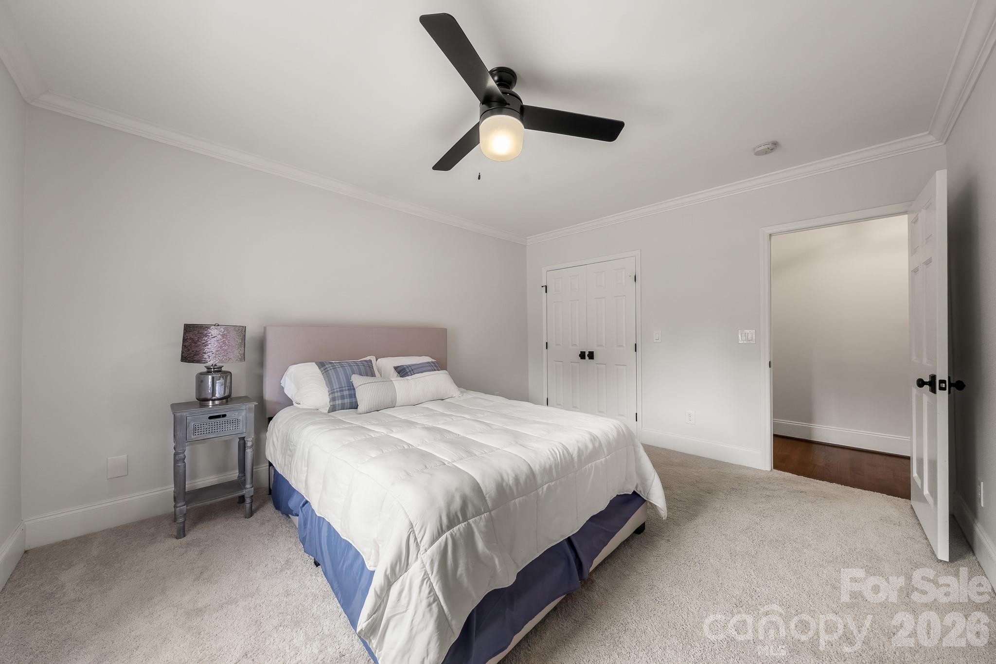 1121 South Wendover Road Charlotte, NC 28211 - Photo 41 of 48 a bedroom with a bed and a ceiling fan