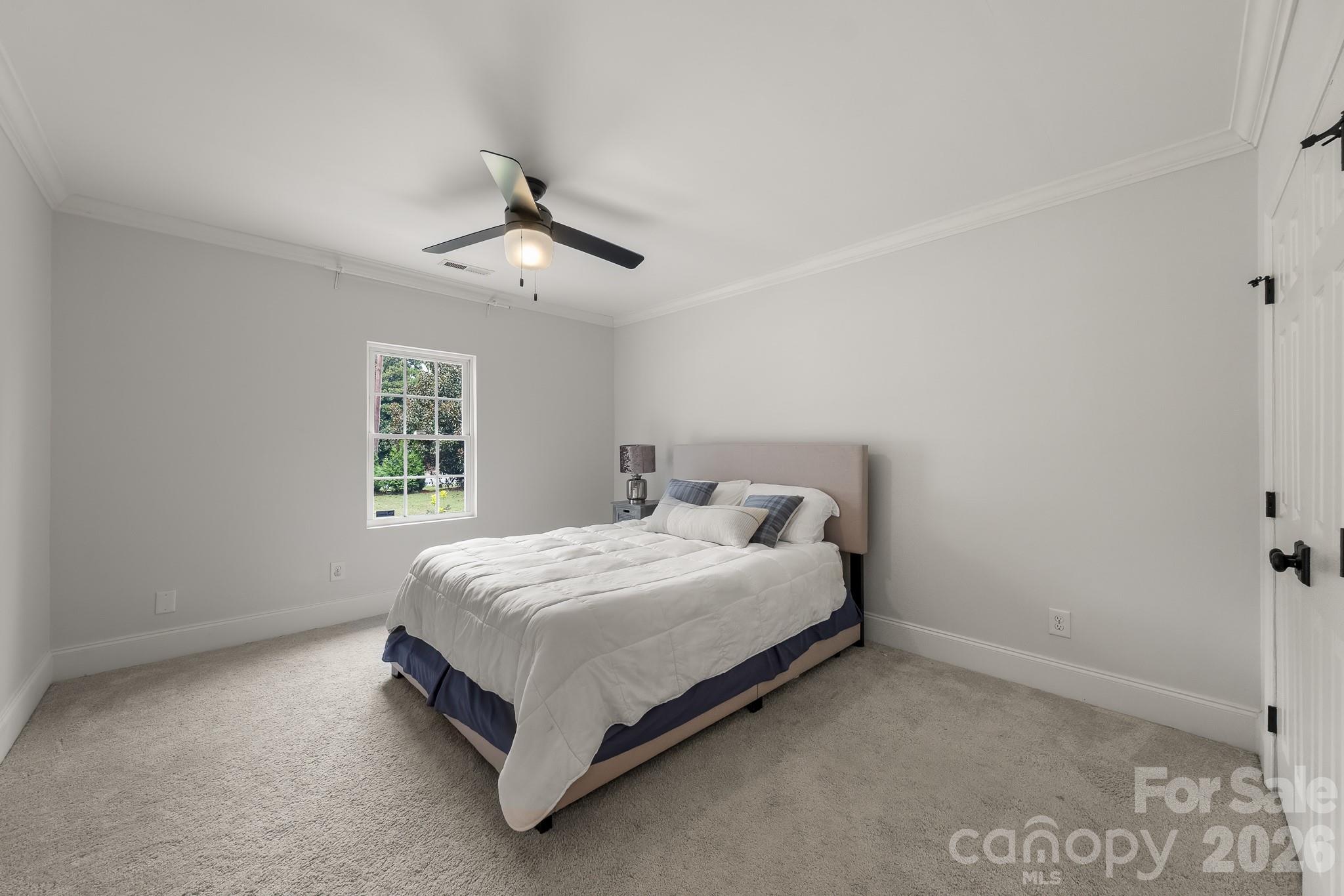 1121 South Wendover Road Charlotte, NC 28211 - Photo 42 of 48 a bedroom with a bed and window