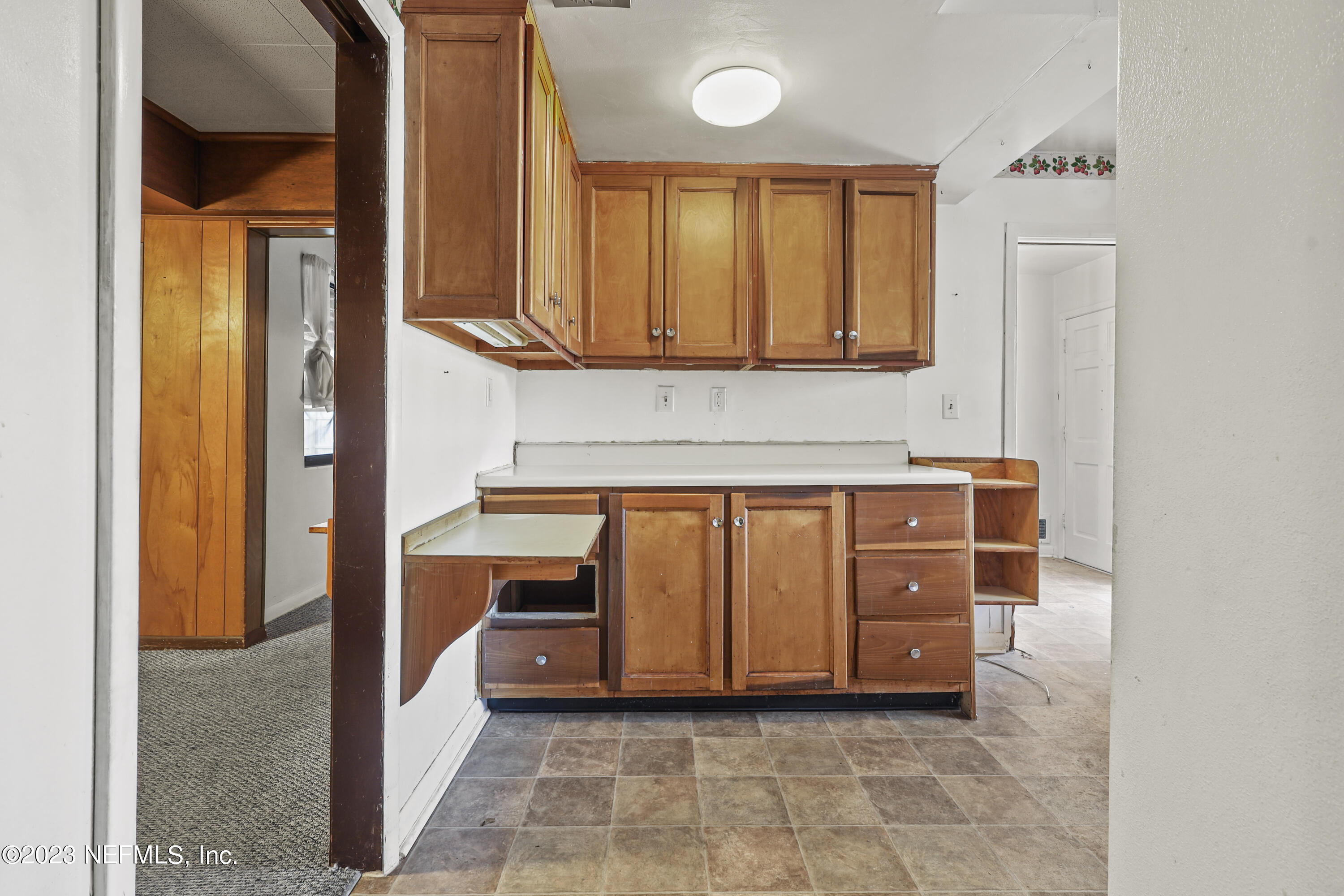 3751 Bess Road Jacksonville, FL 32277 - Photo 15 of 38 a kitchen with stainless steel appliances granite countertop a stove a sink and a microwave