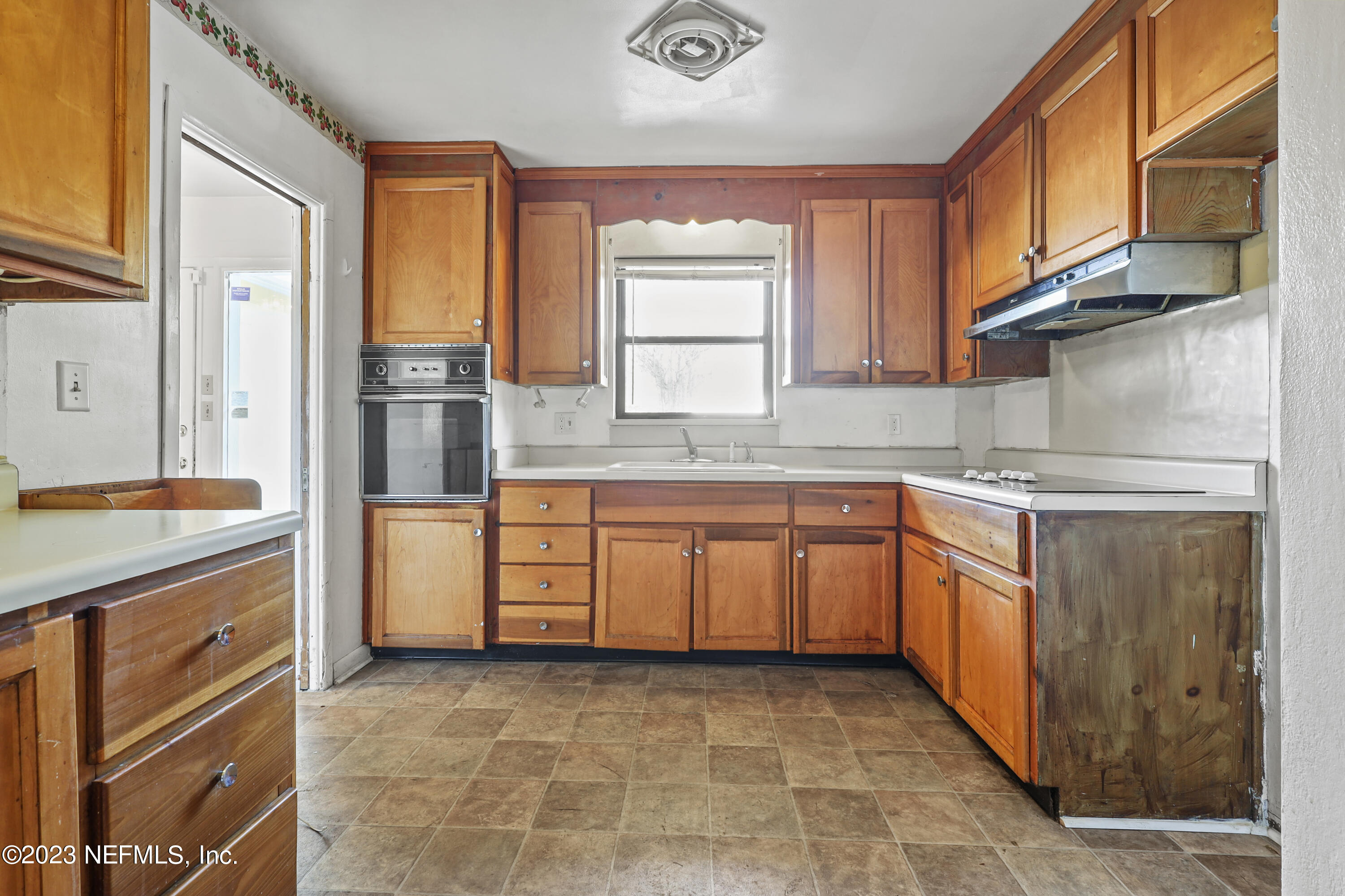 3751 Bess Road Jacksonville, FL 32277 - Photo 16 of 38 a kitchen with stainless steel appliances granite countertop a refrigerator and a sink