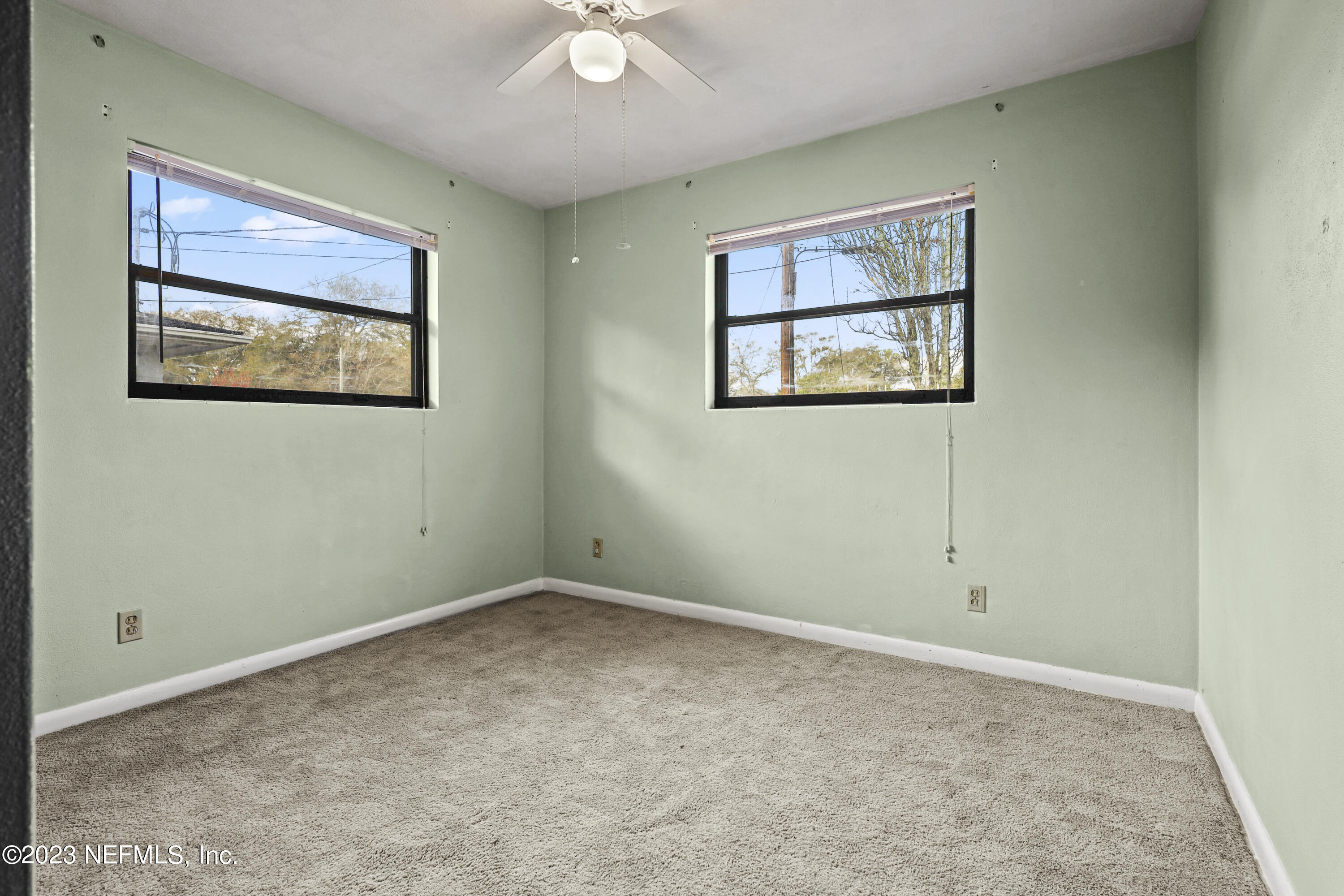 3751 Bess Road Jacksonville, FL 32277 - Photo 23 of 38 an empty room with windows