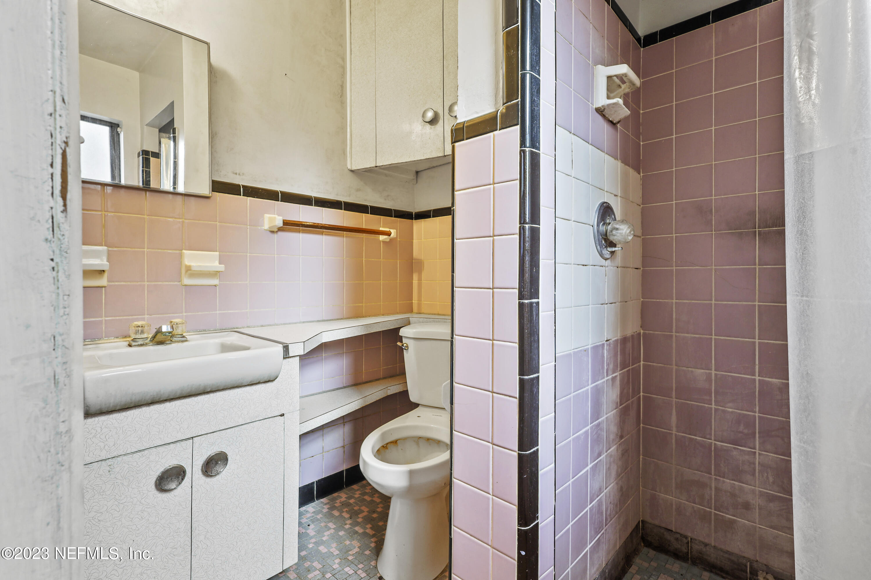 3751 Bess Road Jacksonville, FL 32277 - Photo 28 of 38 a bathroom with a sink toilet and shower