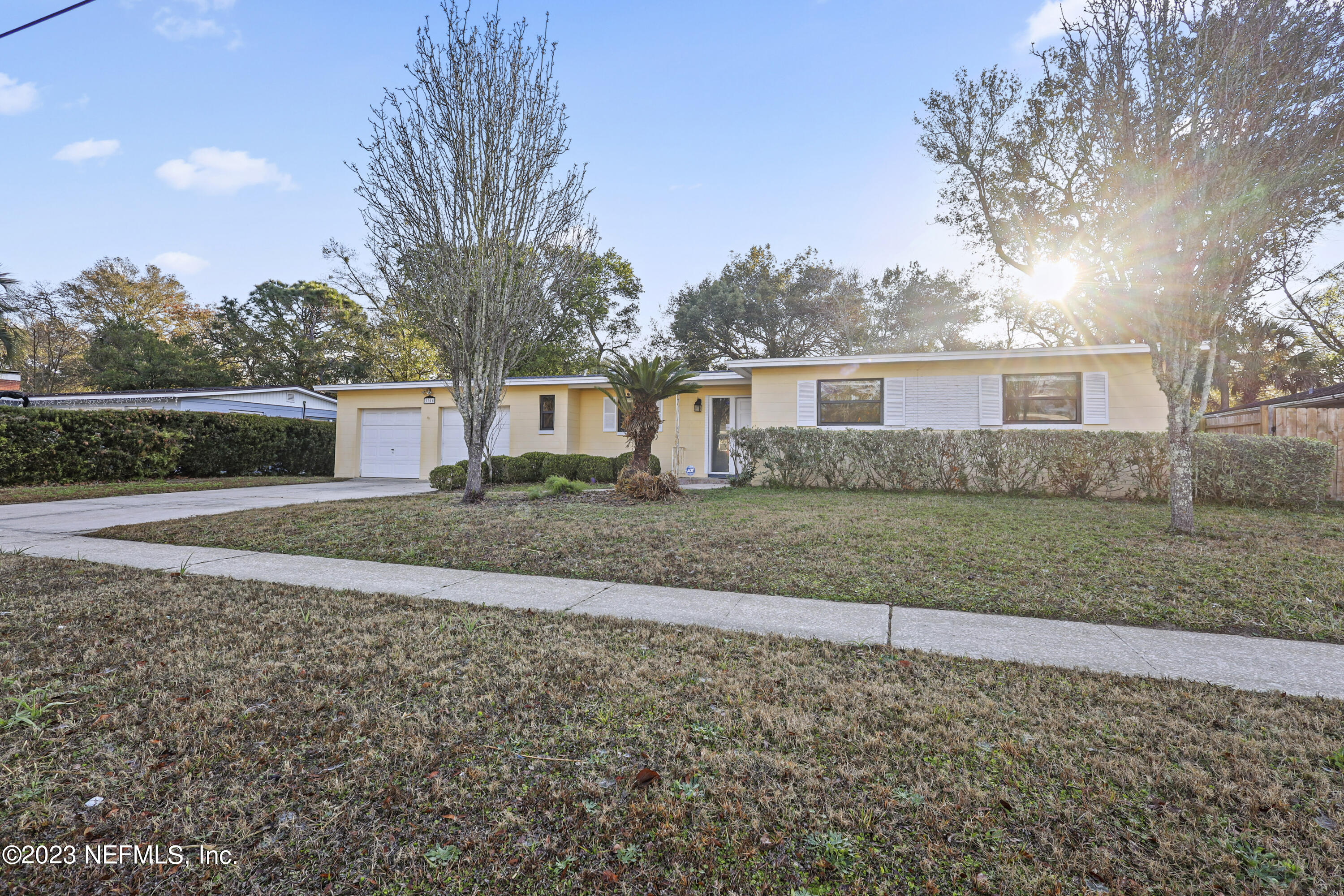 3751 Bess Road Jacksonville, FL 32277 - Photo 3 of 38 a front view of a house with a yard