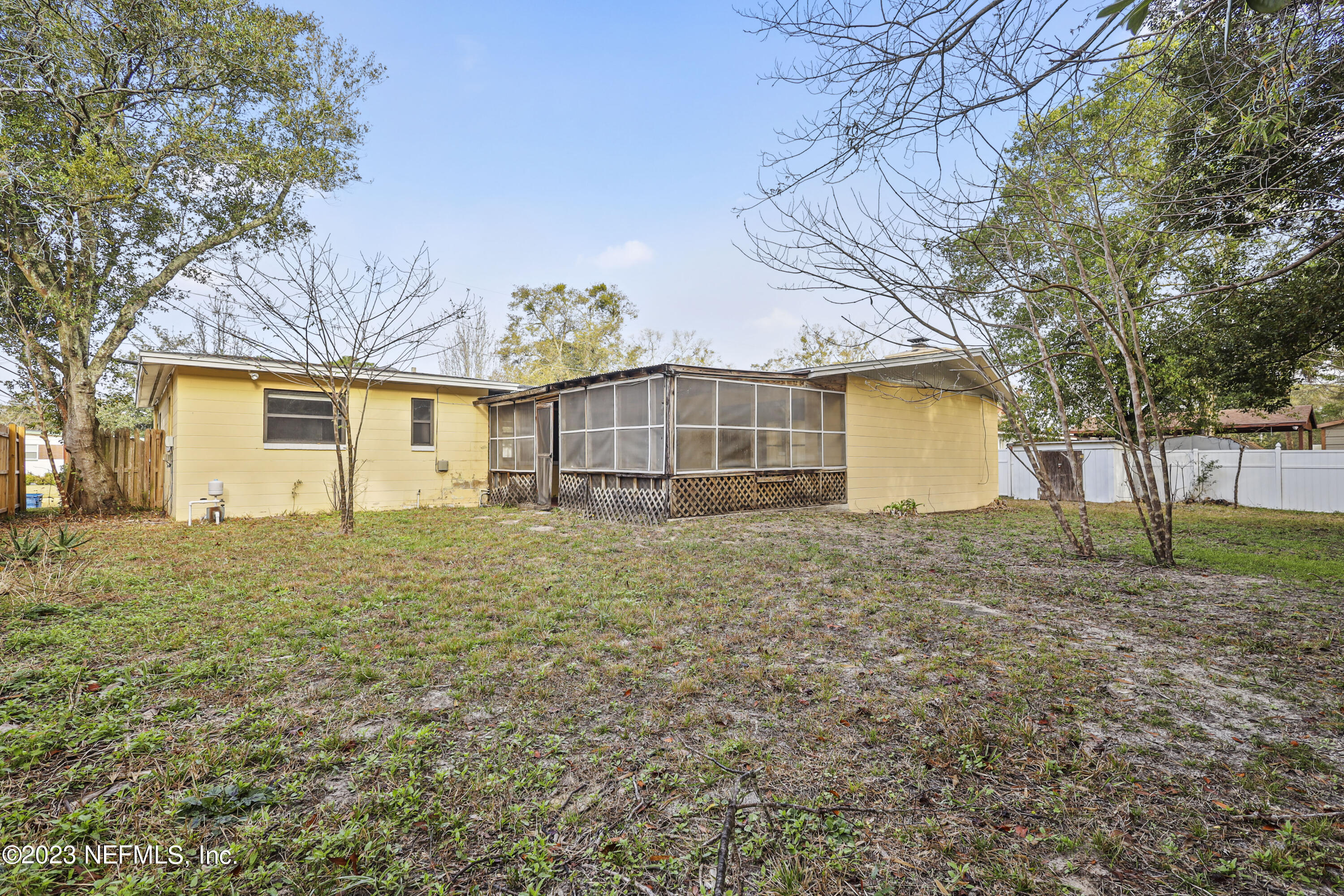 3751 Bess Road Jacksonville, FL 32277 - Photo 33 of 38 a house with trees in front of it