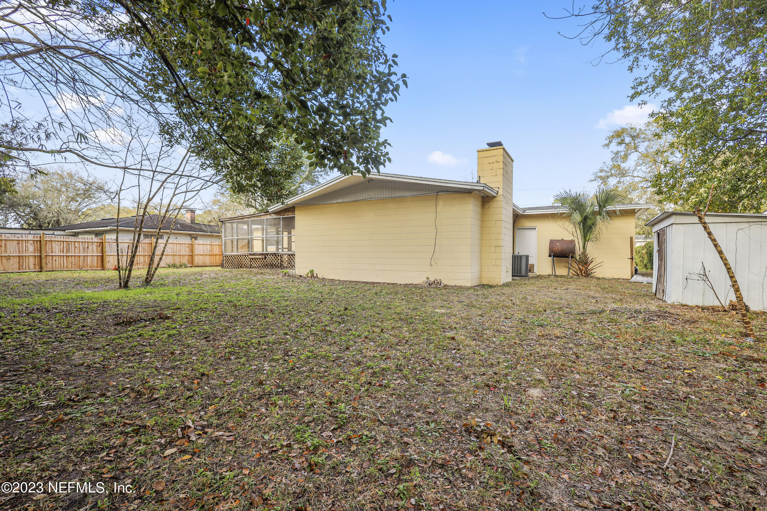 3751 Bess Road Jacksonville, FL 32277 - Photo 34 of 38 a view of a house with a backyard