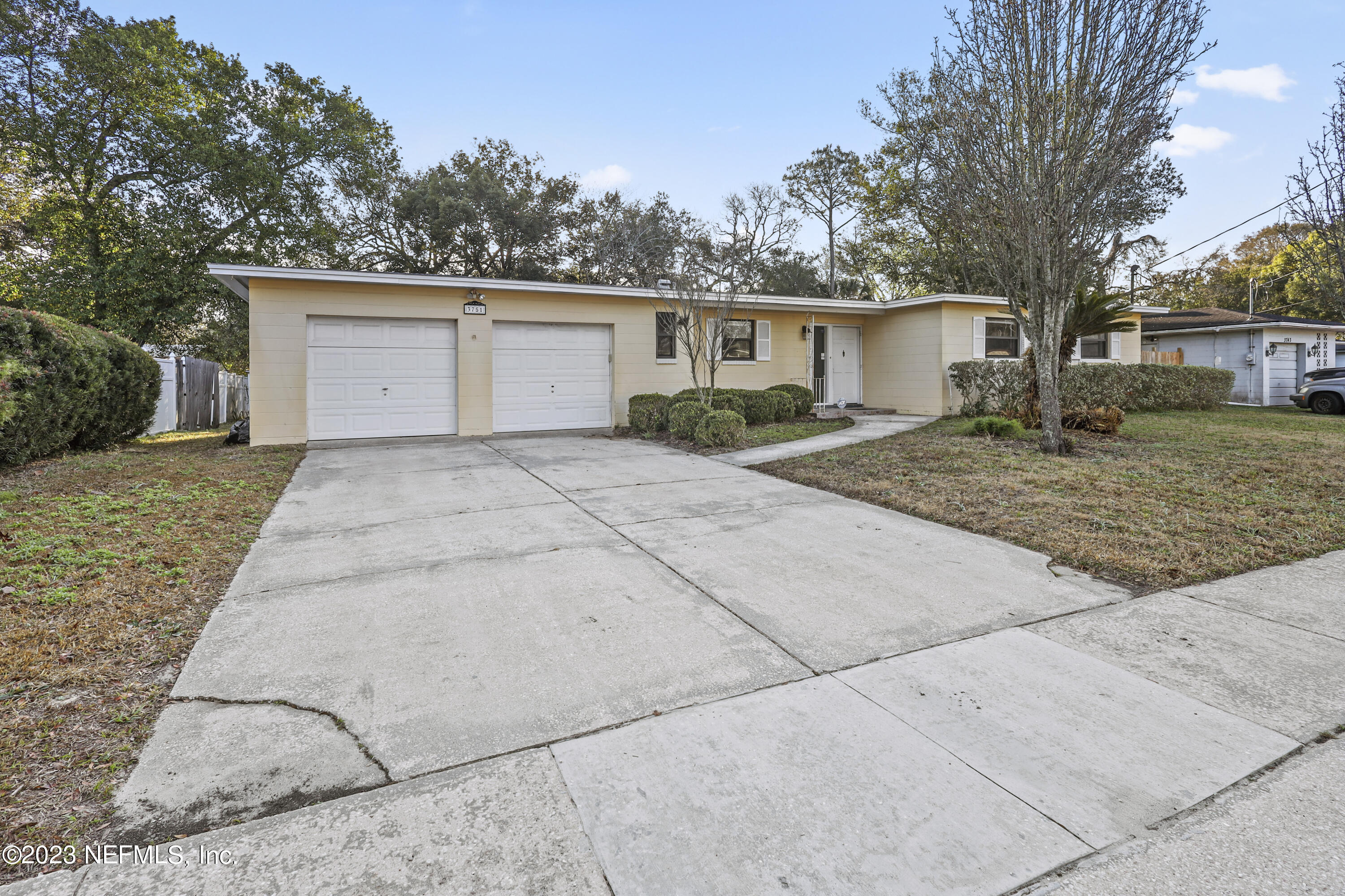 3751 Bess Road Jacksonville, FL 32277 - Photo 4 of 38 a view of a house with a yard and large tree