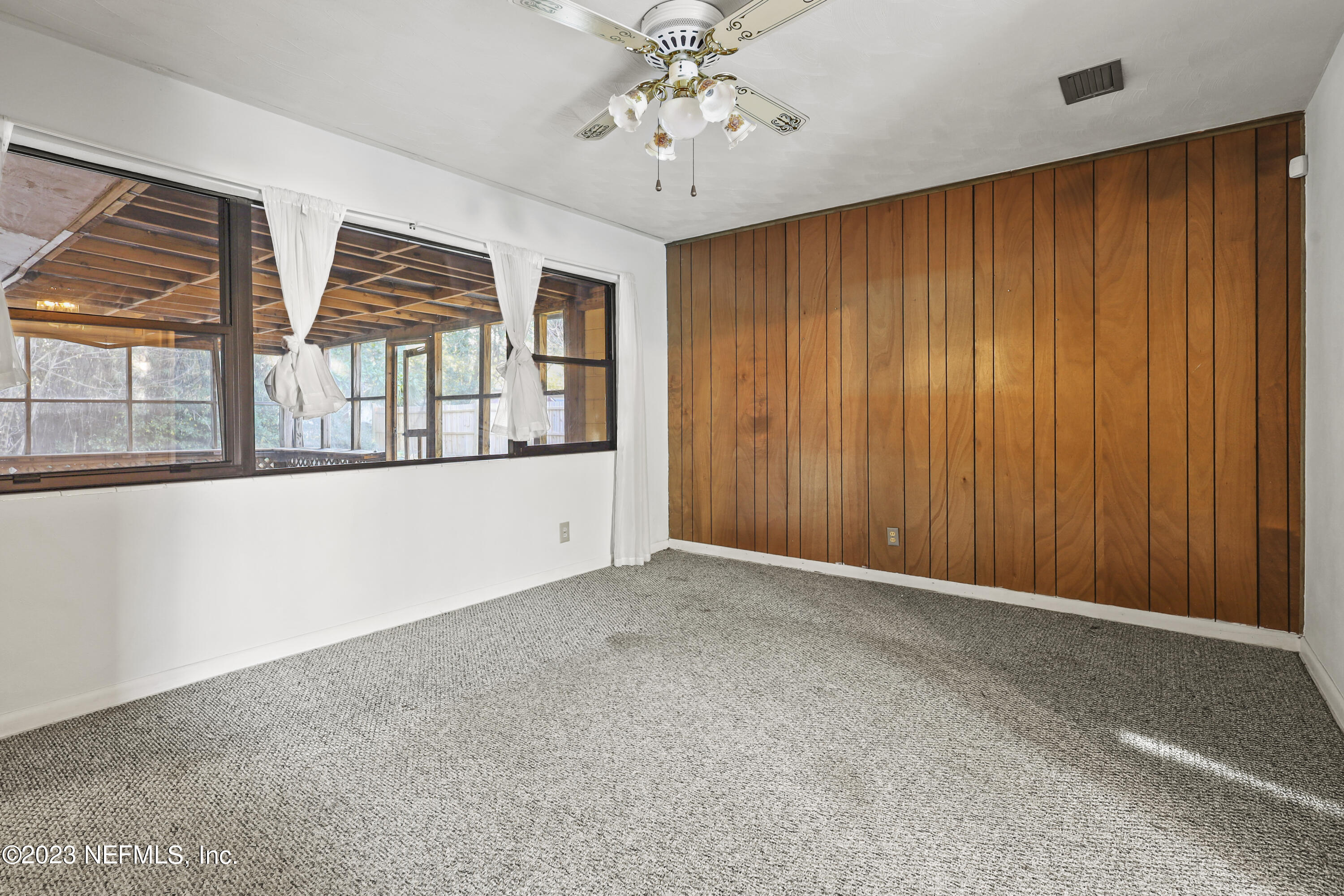 3751 Bess Road Jacksonville, FL 32277 - Photo 8 of 38 an empty room with windows